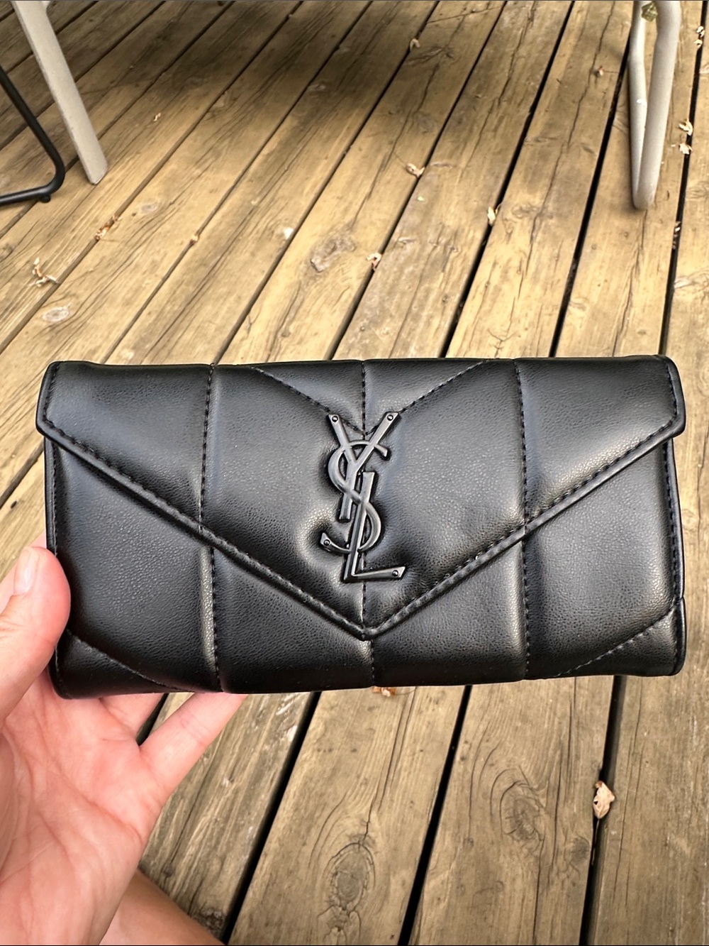 Black Quilted Leather Continental Wallet with black Logo.